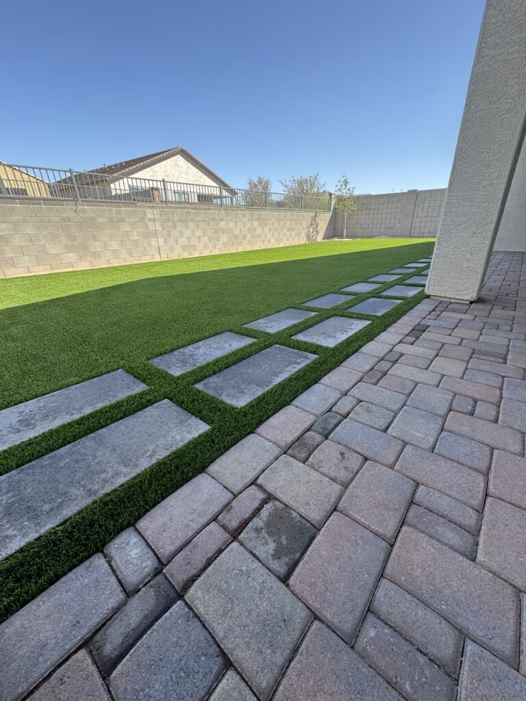 Artificial turf installation in a Gilbert, AZ backyard with clean edging and pet-friendly grass by All Valley Turf