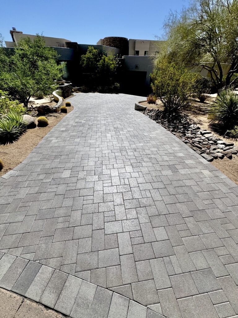 Luxury paver driveway after sealing at Desert Foothills Golf Club in Cave Creek Arizona with premium wet-look finish by All Valley Turf
